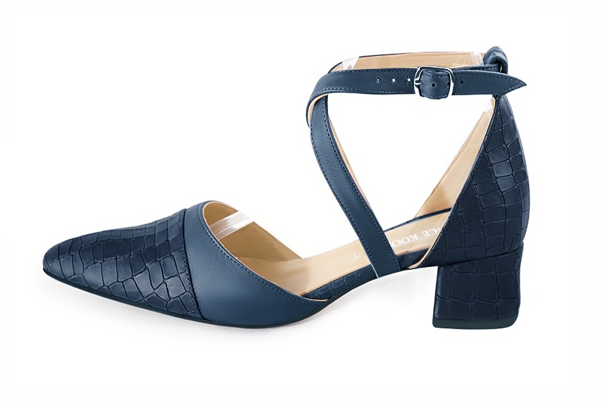 Denim blue women's open side shoes, with crossed straps. Tapered toe. Low flare heels. Profile view - Florence KOOIJMAN